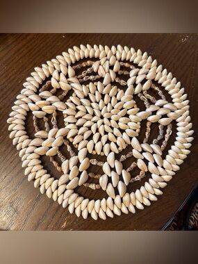vintage cowrie shell trivet / wall decor